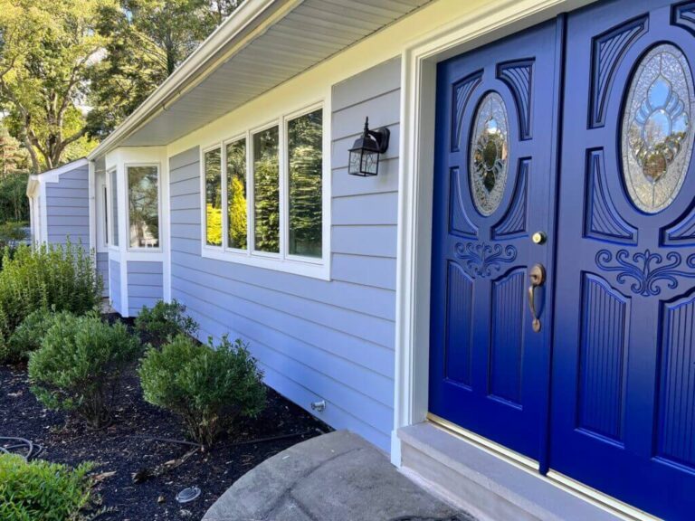 Freshly painted house exterior with a smooth stucco finish by Burge Painting